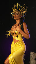 Load image into Gallery viewer, Model wears metallic yellow dress with gold 3D adornments and gold leaf crown designed by Best Caribbean Fashion Designer in Trinidad, Jin Forde.