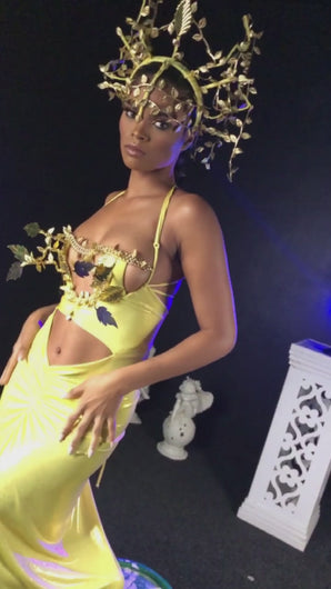 Model wears metallic yellow dress with gold 3D adornments and gold leaf crown designed by Best Caribbean Fashion Designer in Trinidad, Jin Forde