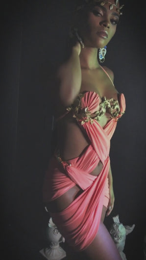 Fashion Model wears Carnival Inspired coral wire bra draped mini dress with gold leaf details designed by Best Caribbean Fashion Designer in Trinidad, Jin Forde.