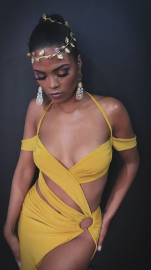 Model wears strappy stylish halter mustard dress designed by Best Caribbean Fashion Designer in Trinidad, Jin Forde.